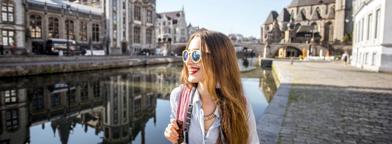 6 Reasons to Include Ghent, Belgium on Your Travels - tourist young woman in sun glasses