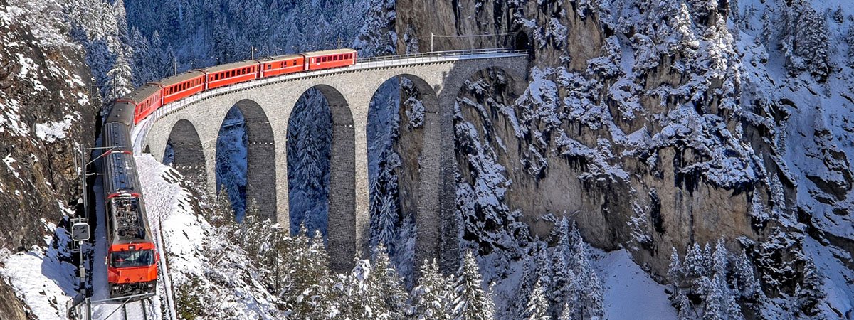 5 Winter Destinations - red-coloured train near Zermatt
